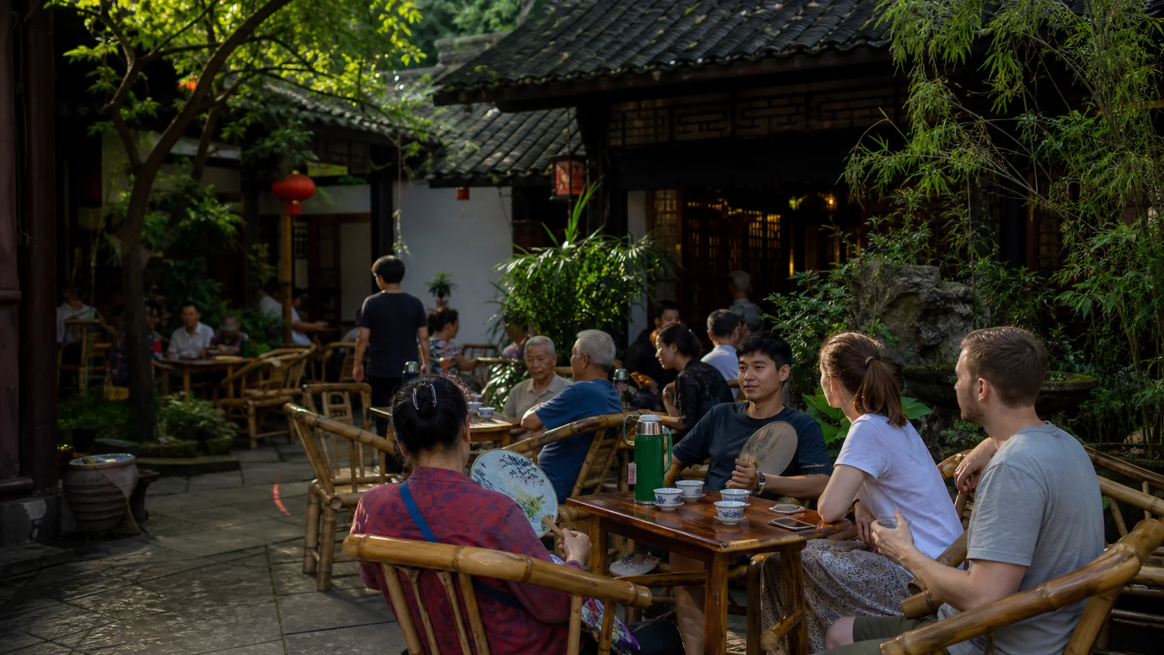 Local residents and international visitors sharing Chengdu teahouse life